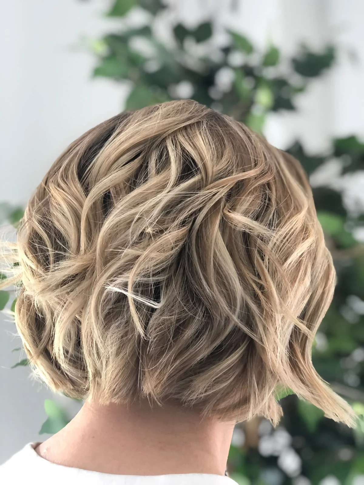 Dimensional blonde bob with soft textured waves, created by Lois